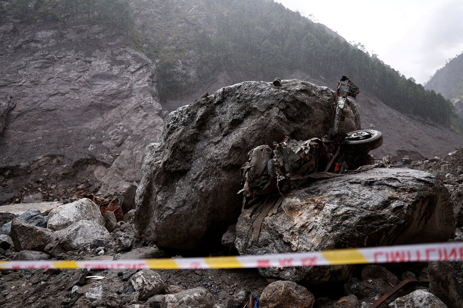 Tape cordons off an area near a damaged vehicle at the core disaster-hit area at Kyirong (Gyirong) Port during an organized media tour in Shigatse, Tibet, Sept. 6, 2026.