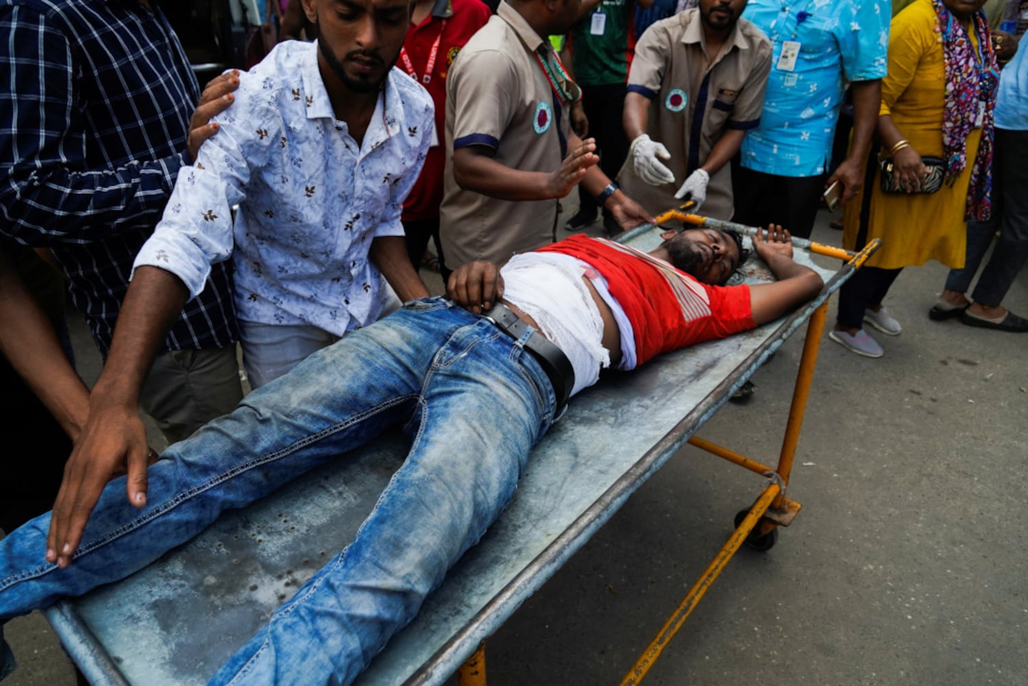 An injured man is treated at the Dhaka Medical College Hospital as violence continues across the country tied to anti-quota protests by students, July 19, 2024. (Sultan Mahmud Mukut/Reuters)