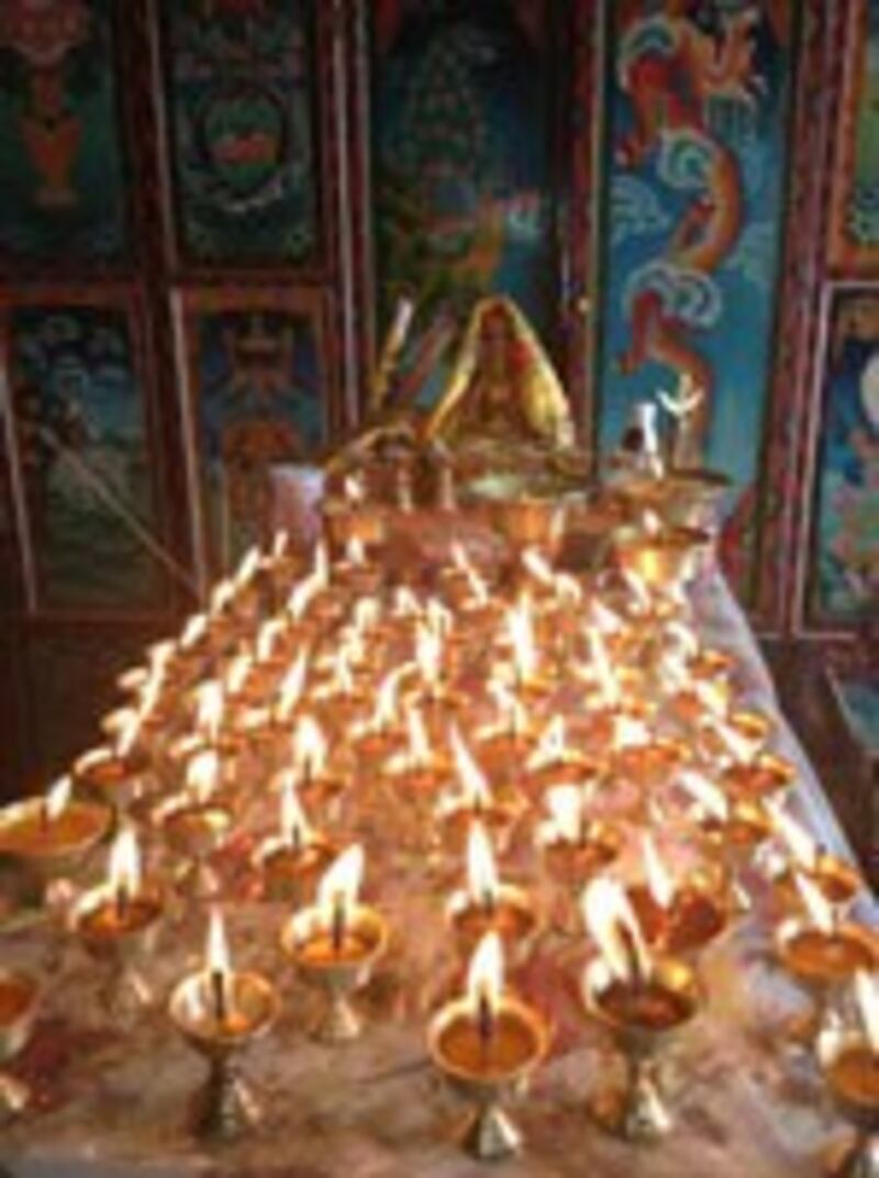 Butter lamps offered in prayer, Feb. 25, 2013.