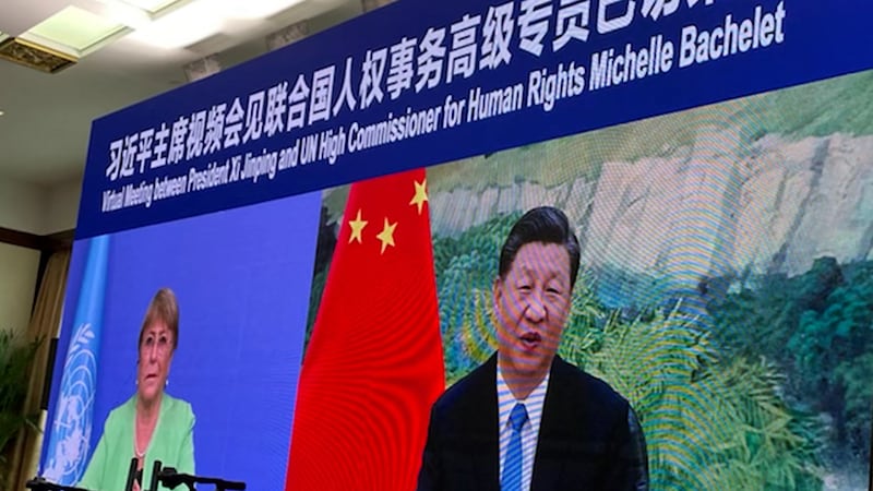 In a file photo, U.N. human rights chief Michelle Bachelet (L) attends a virtual meeting with Chinese President Xi Jinping, in Guangzhou, China, May 25, 2022.