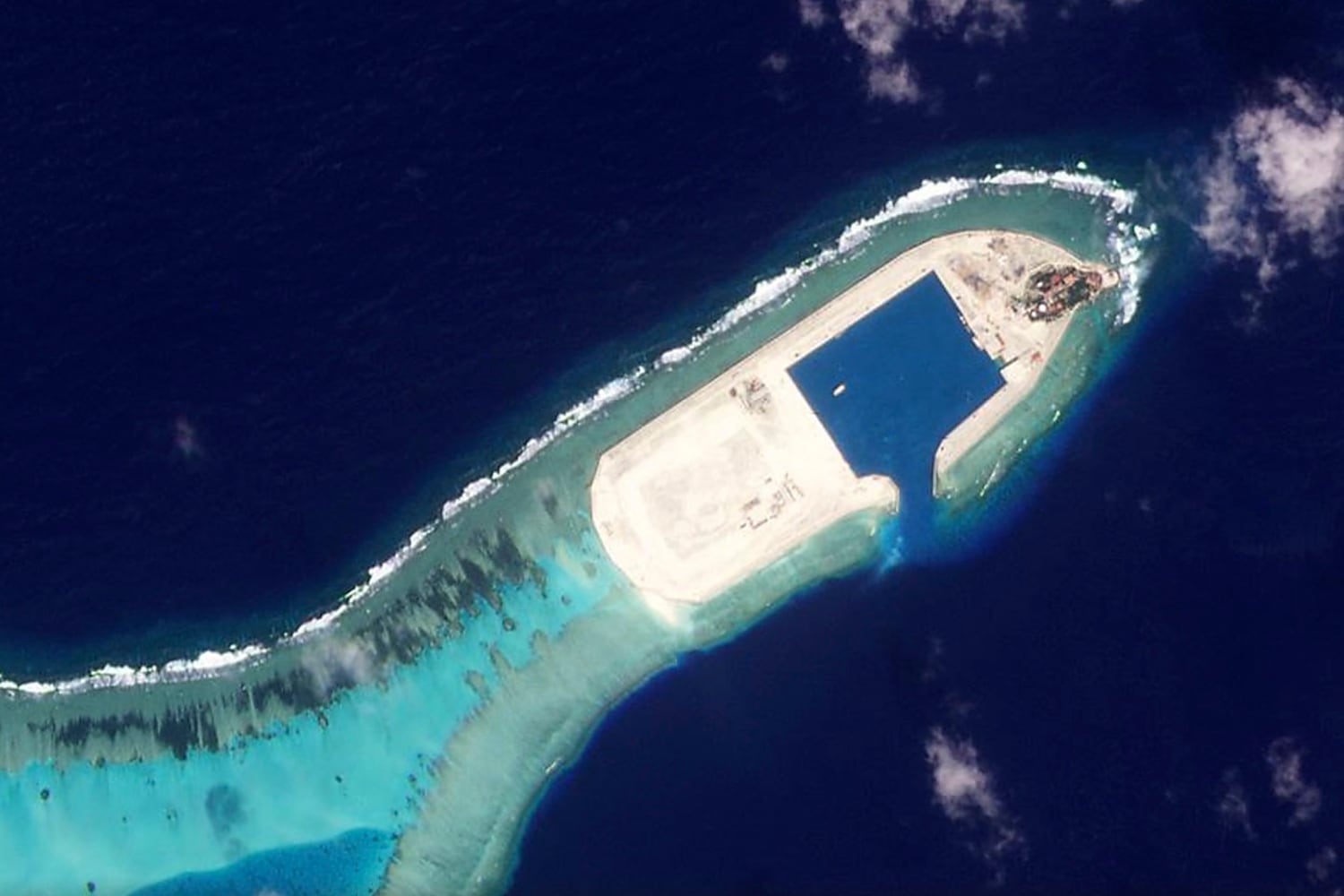 South China Sea: Massive chunk of coral reef destroyed by island-building rivals