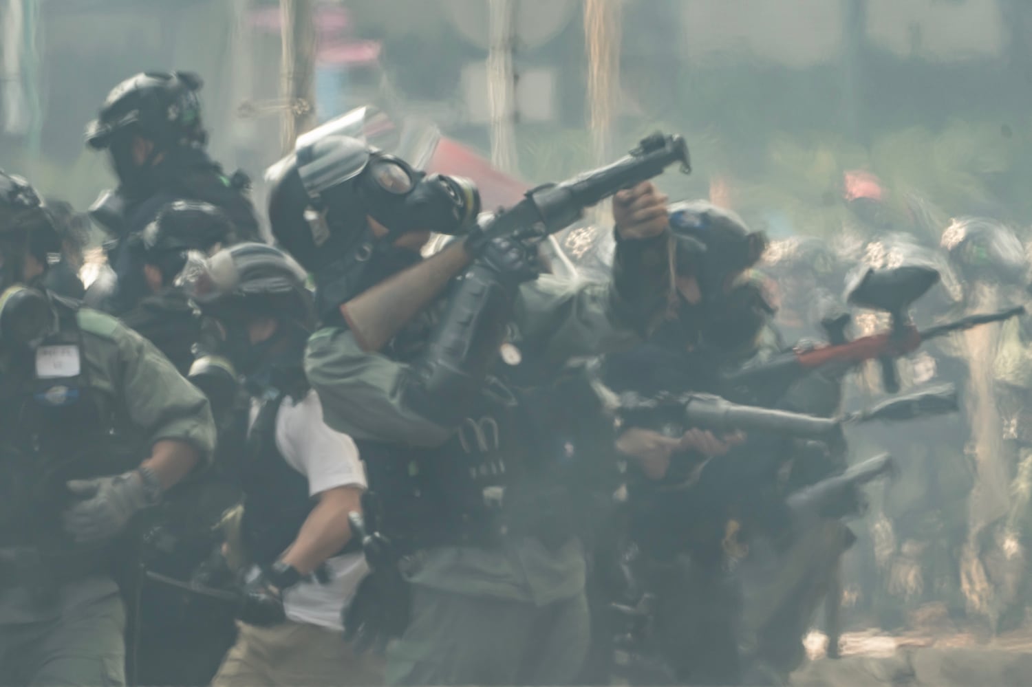 Riot police aim with teargas launchers during an escape of protesters at The Hong Kong Poytechnic University on November 18, 2019 in Hong Kong. (Anthony Kwan/Getty Images)