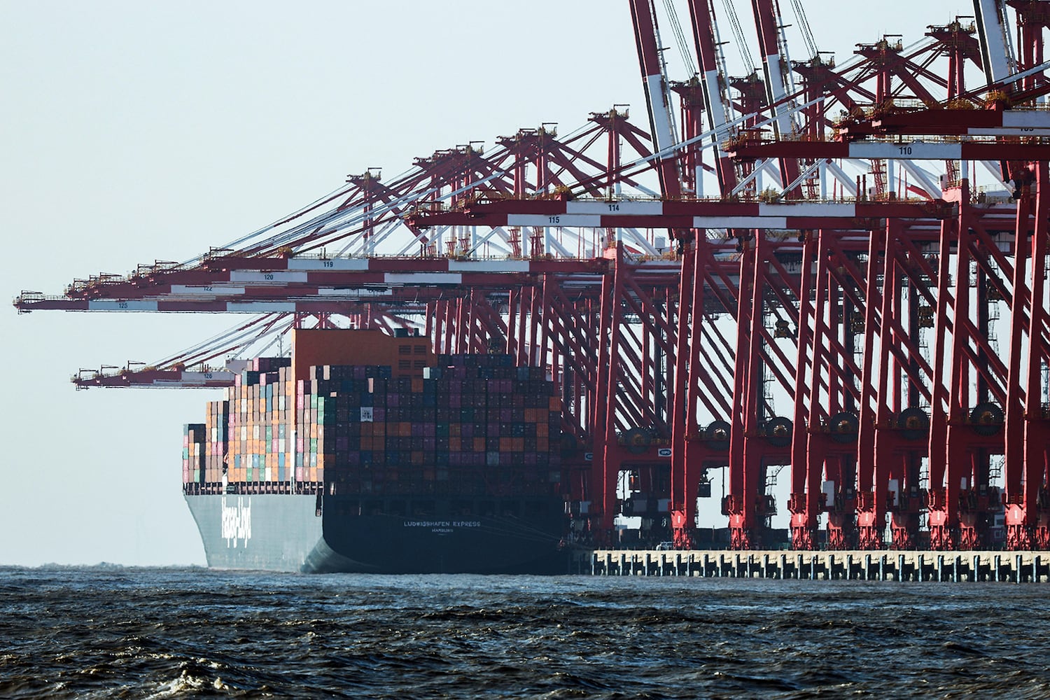 Gantry cranes stand near a cargo ship at Yangshan Port outside of Shanghai, China, Feb. 7, 2025.