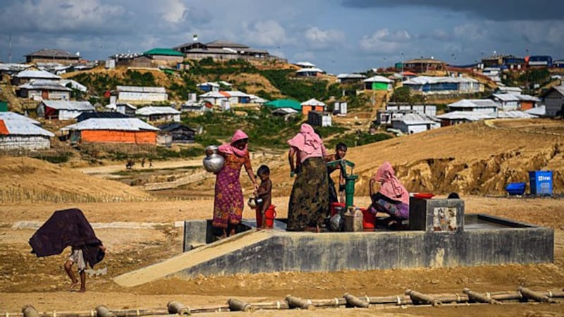 Rohingya refugees from Myanmar collect water at the Kutupalong refugee camp in Ukhia sub-district of Cox's Bazar in southeastern Bangladesh, Aug. 8, 2018.
