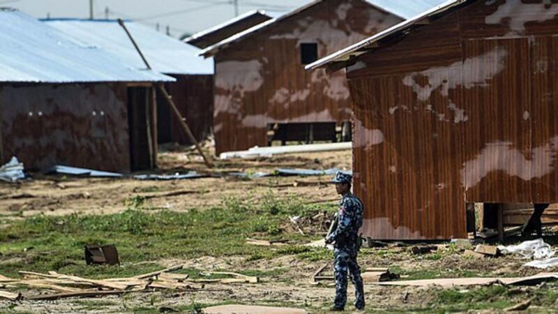 A Myanmar border police officer secures the Hla Pho Khaung processing camp for Rohingya Muslims refugees near the Bangladesh border in Maungdaw township, western Myanmar's Rakhine state, April 24, 2018.
