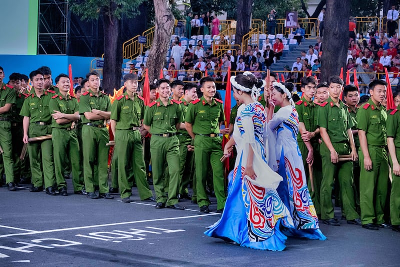 Parade participants gather before the start of the 50th anniversary celebration of the end of the Vietnam War, April 30, 2025, in Ho Chi Minh City, Vietnam.