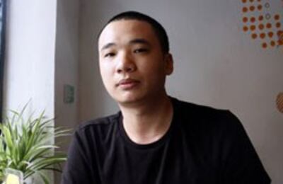 Anh Nguyễn Hà Đông, tác giả trò chơi Flappy Bird trong một quán cà phê ở Hà Nội hôm 5 tháng 2 năm 2014. AFP PHOTO.