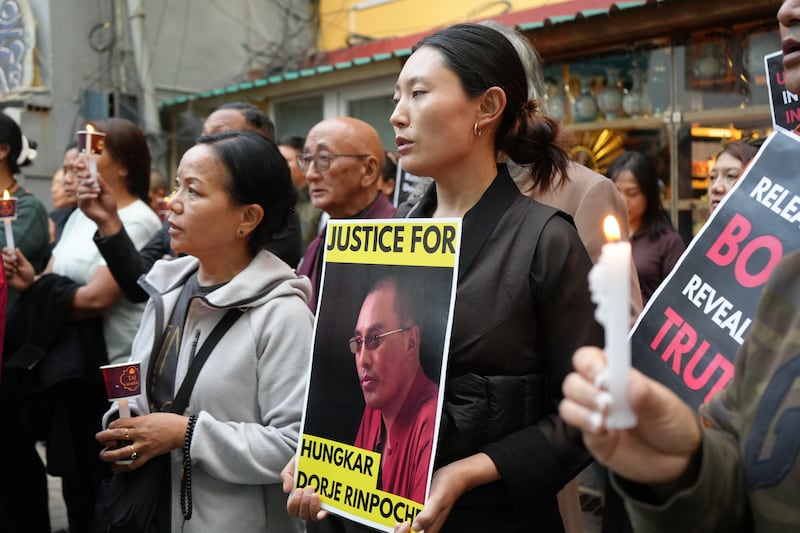 Tibetan devotees hold a candlelight vigil for Tulku Hungkar Dorje in Dharamsala, India, April 11, 2025.