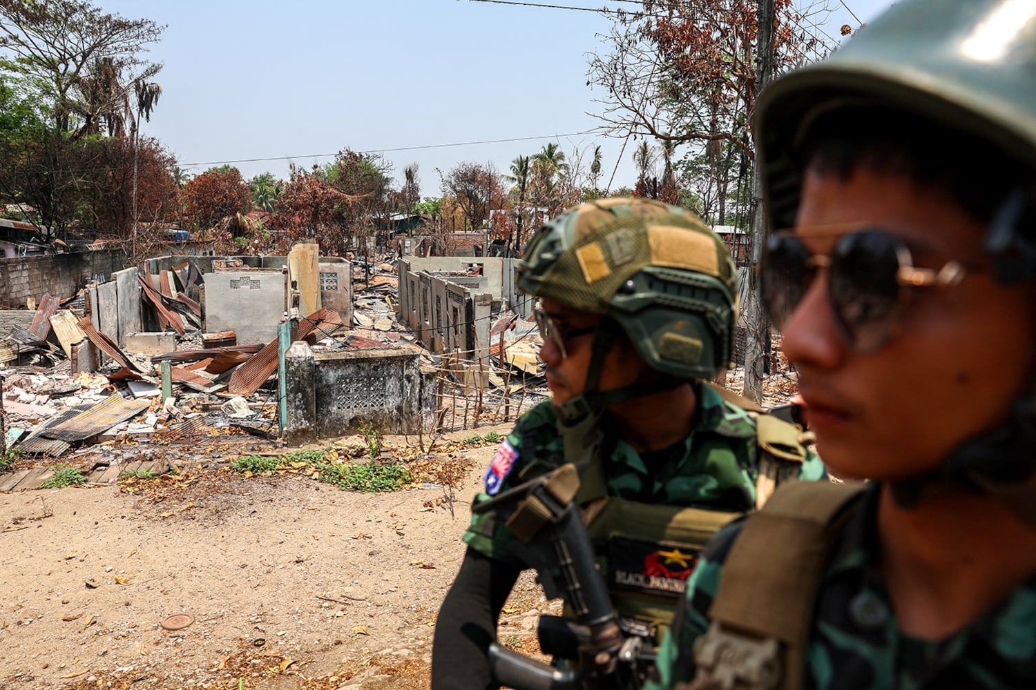 Soldiers from the Karen National Liberation Army patrol in an area hit by a junta airstrike in Myawaddy,, April 15, 2024.