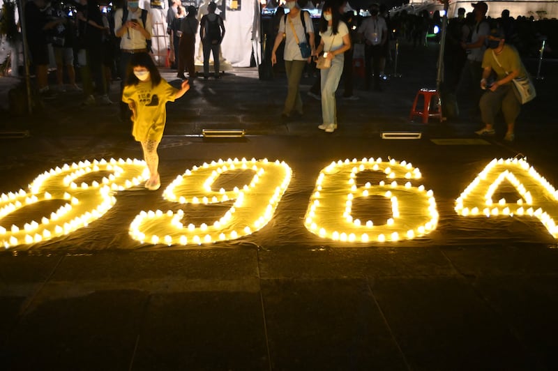 A child walks among the numbers "8964" during a vigil on the 33rd anniversary of the 1989 Tiananmen Square pro-democracy protests and crackdown, at Chiang Kai-shek Memorial Hall in Taipei on June 4, 2022.
