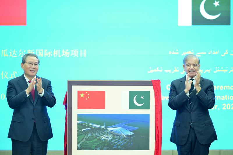 Chinese Premier Li Qiang and Pakistan's Prime Minister Shehbaz Sharif react after unveiling a plaque to mark the completion of the New Gwadar International Airport, during a ceremony at the Prime Minister's House in Islamabad, Pakistan October 14, 2024. Prime Minister's House/Handout via REUTERS  THIS IMAGE HAS BEEN SUPPLIED BY A THIRD PARTY