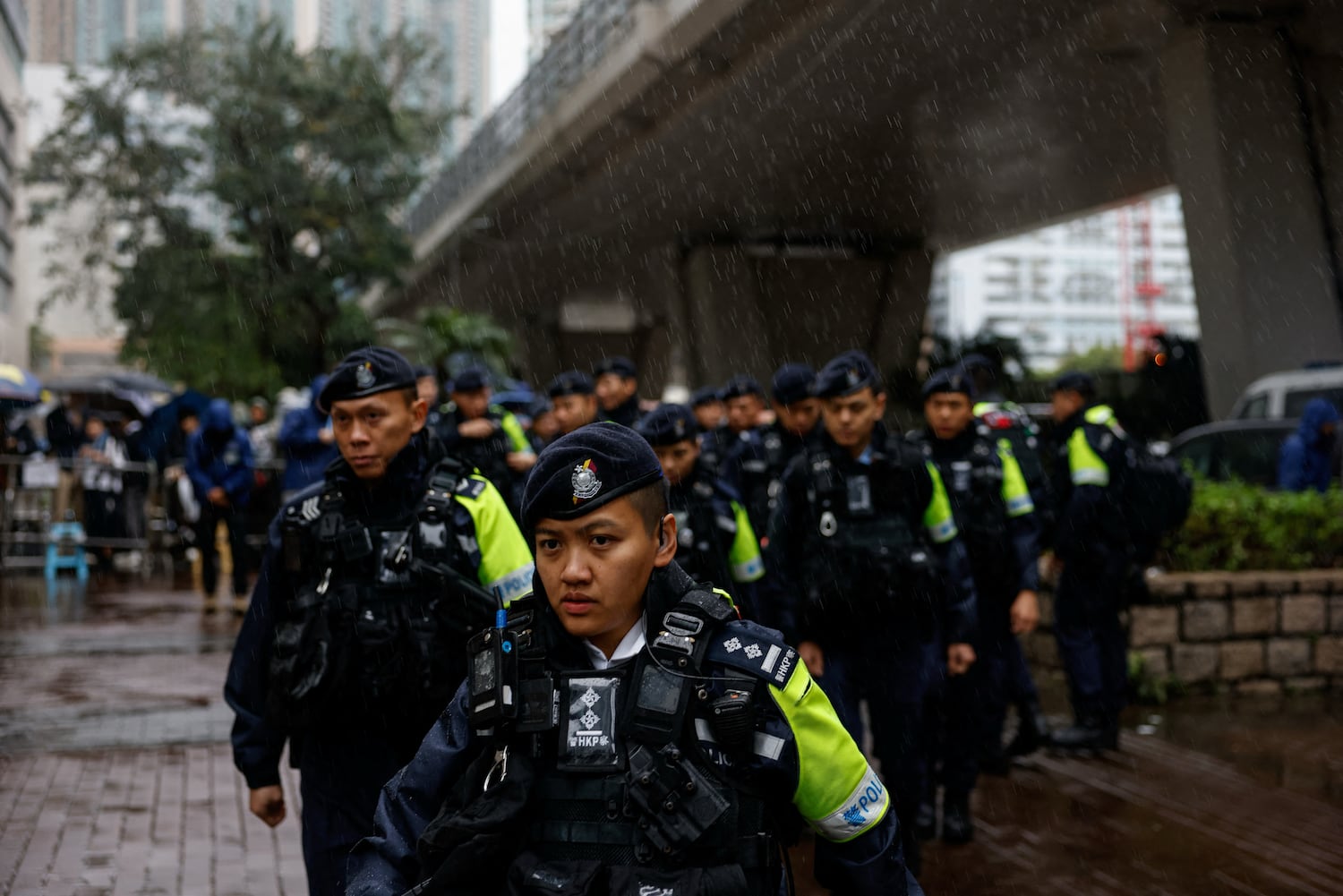 Police patrol outside the West Kowloon Magistrates' Courts building as Jimmy Lai, the founder of the now-defunct pro-democracy newspaper Apple Daily, takes the witness stand for the first time in the national security collusion trial, in Hong Kong, China, Nov. 20, 2024.