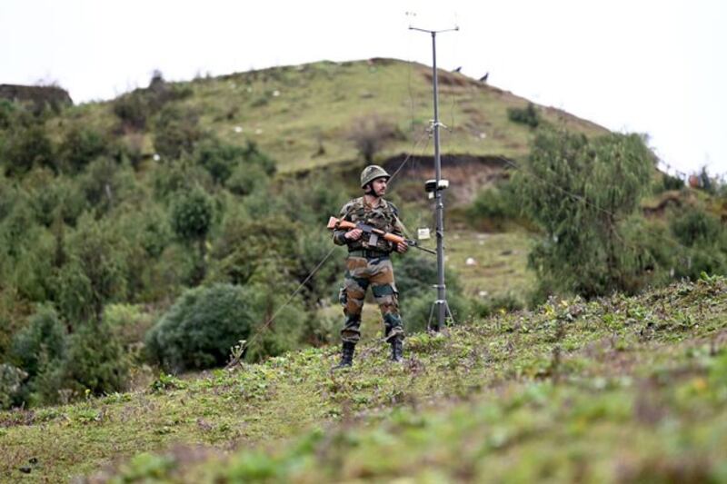 An Indian Army soldier stands guard at a post in Tawang near the Line of Actual Control with China in the northeast Indian state of Arunachal Pradesh, Oct. 20, 2021.