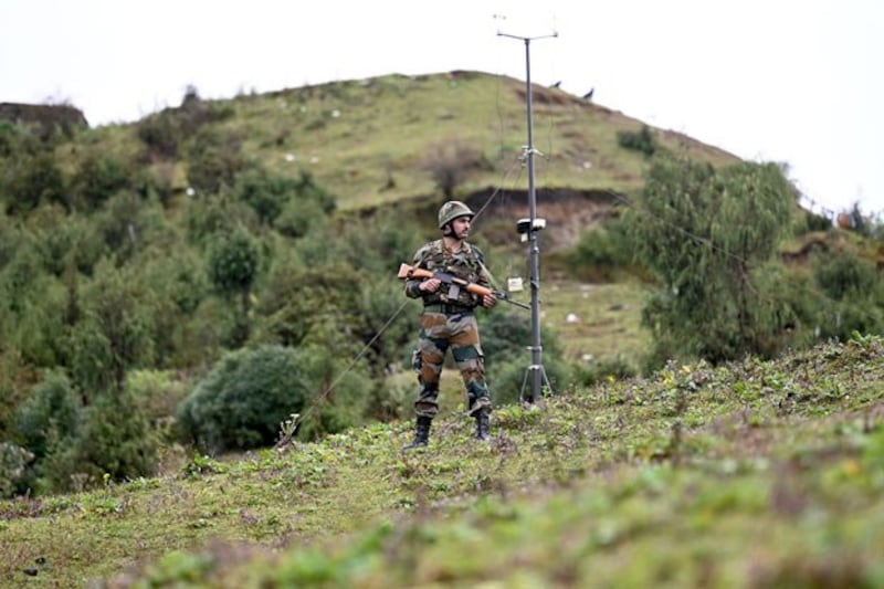 An Indian Army soldier stands guard at a post in Tawang near the Line of Actual Control with China in the northeast Indian state of Arunachal Pradesh, Oct. 20, 2021.