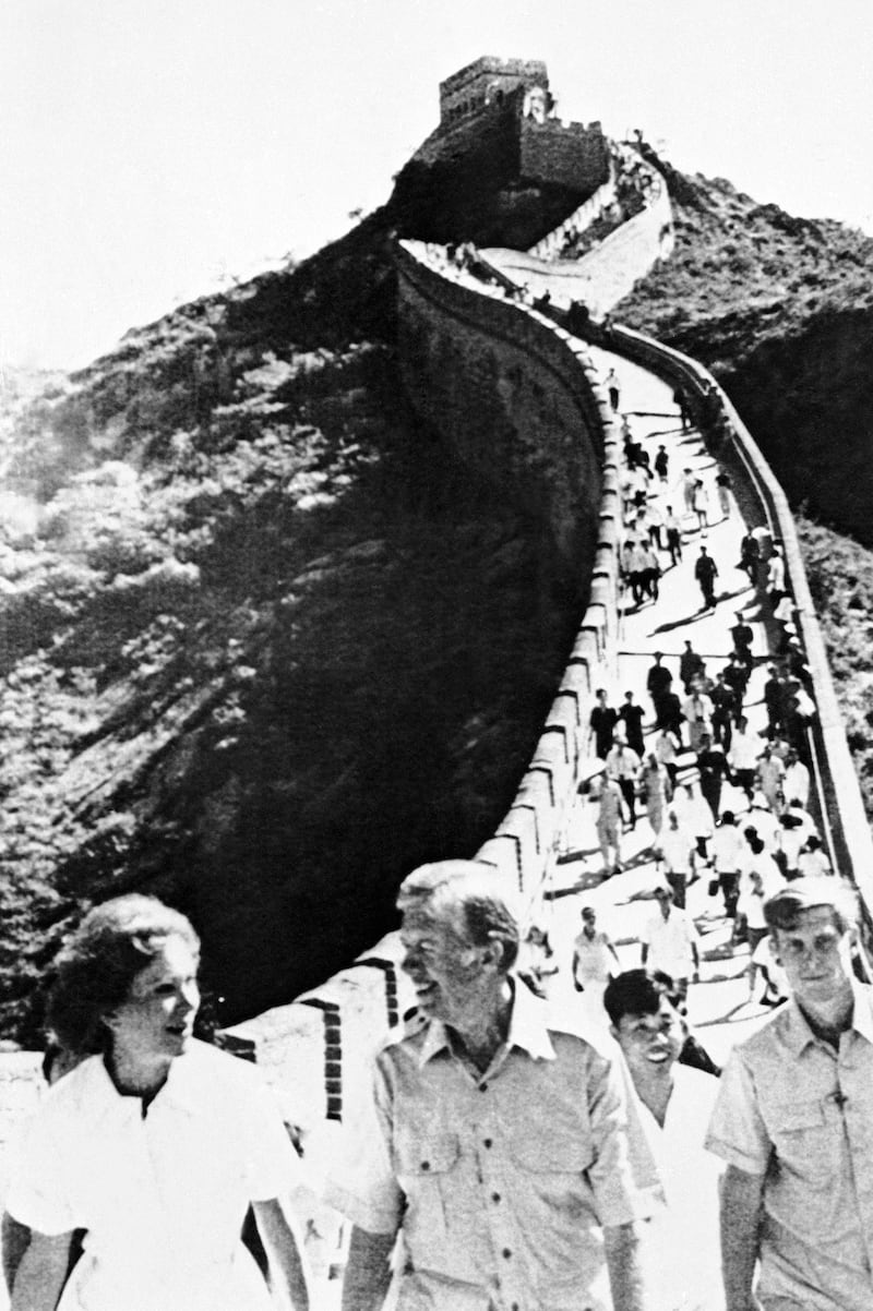 Former U.S. President Jimmy Carter and his wife Rosalynn walk at the Great Wall of China, Aug. 26, 1981.