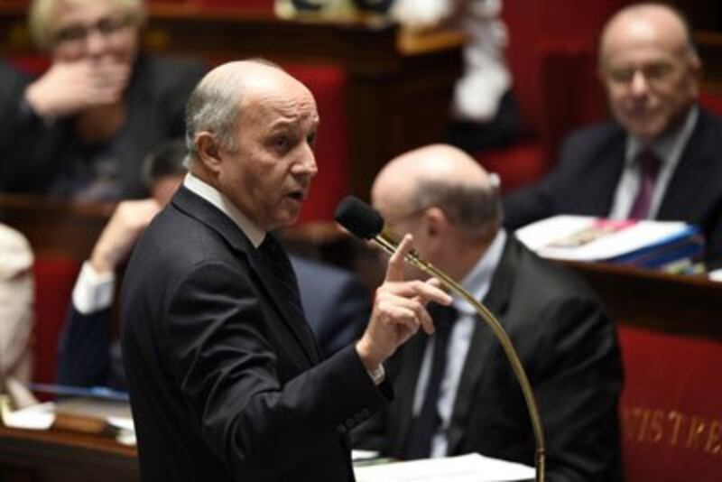 Bộ trưởng Ngoại giao Pháp Laurent Fabius phát biểu về kết quả của hội nghị biến đổi khí hậu COP21 tại Quốc hội ở Paris hôm 15/12/2015. AFP photo 