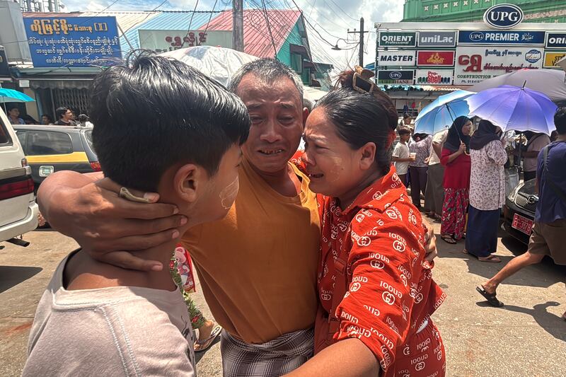 A released prisoner, center, is welcomed by family members outside the main gate of Insein prison as the head of Myanmar’s military government granted amnesty to thousands of prisoners to mark the country’s traditional New Year Thursday, April 17, 2025, in Yangon, Myanmar.