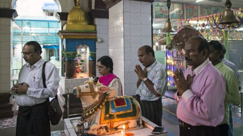 Myanmar Hindu devotees gather for prayers at a temple in Yangon on Aug. 25, 2018, to remember the Hindus killed by Rohingya militants in western Myanmar's Rakhine state a year earlier.