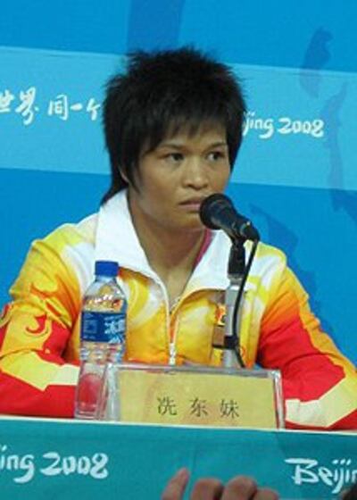 图片：举重获得者洗东妹（RFA/谷季柔）
