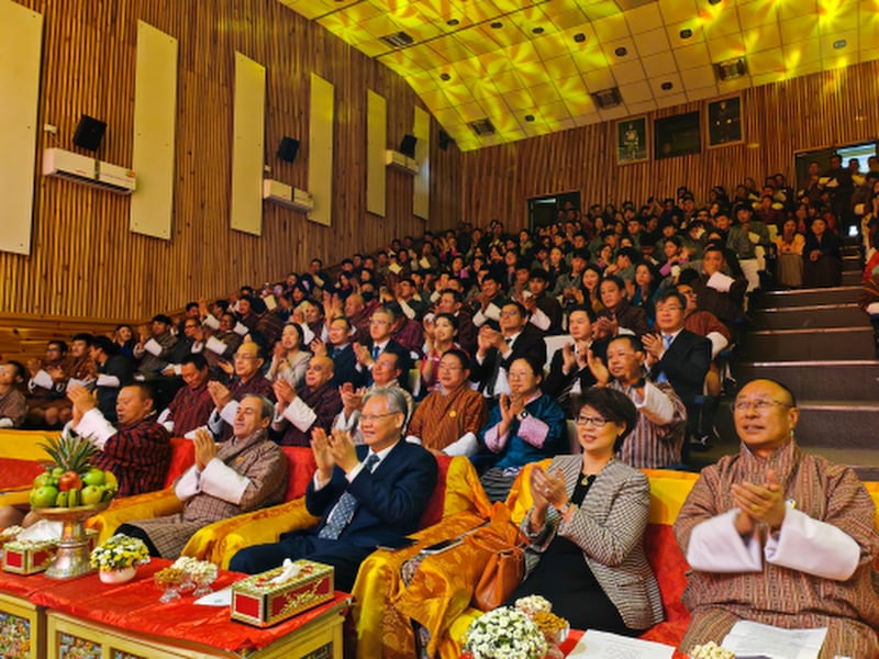 Chinese Ambassador to India Xu Feihong sits with Bhutanese government officials at an event in Thimphu, Bhutan, where Tibetans artists performed.