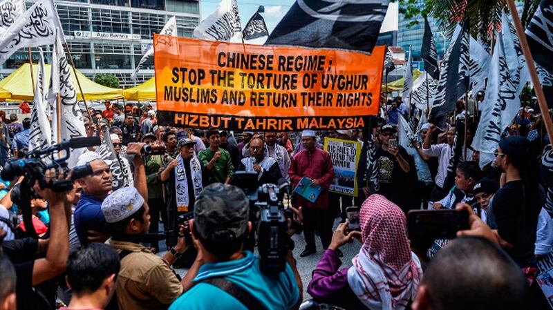 Members of Hizbut Tahrir Malaysia rally outside China's embassy in Kuala Lumpur to condemn the detention of Uyghurs in the Xinjiang region, Dec. 27, 2019.