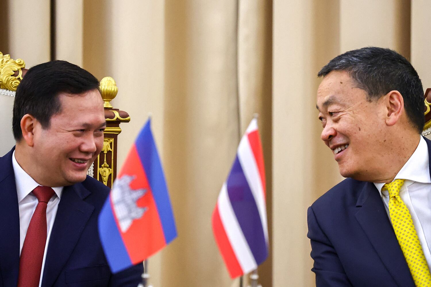 Cambodia Prime Minister Hun Manet and Thailand's then-Prime Minister Srettha Thavisin laugh during a news conference in Bangkok, Feb. 7, 2024.
