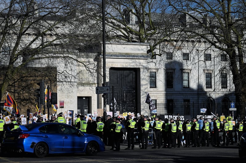 Police stand watch as protesters gather in front of the historic former Royal Mint Court — the proposed site of the Chinese “mega-embassy” — in London, March 15, 2025.