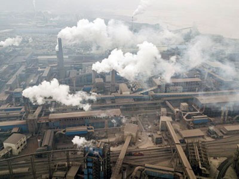 Steel factories emit pollution in Hancheng, northern China's Shaanxi province, Feb. 17, 2018.
