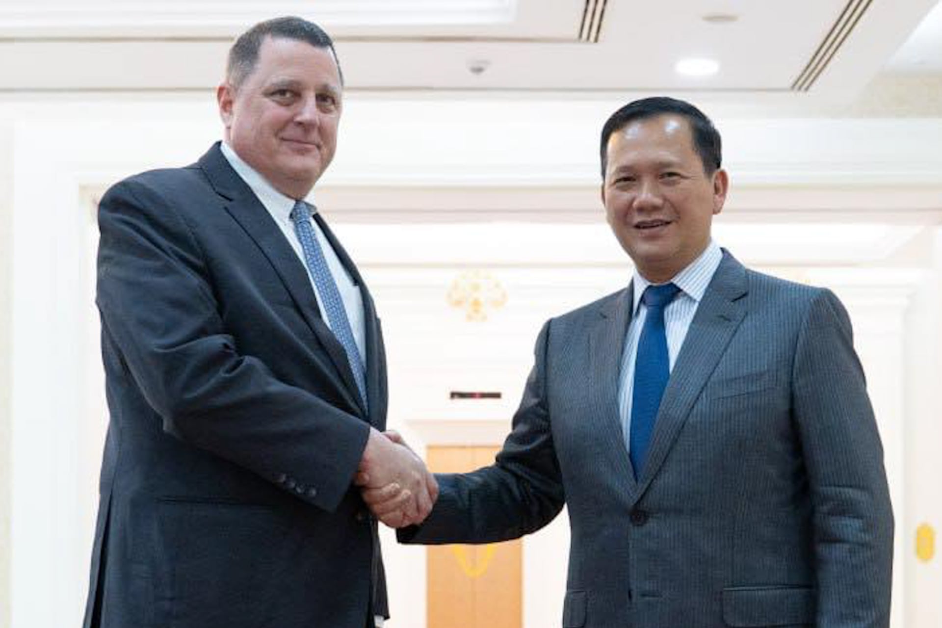 Cambodian PM Hun Manet's shaking with US senior Senate Staffer Paul Grove.