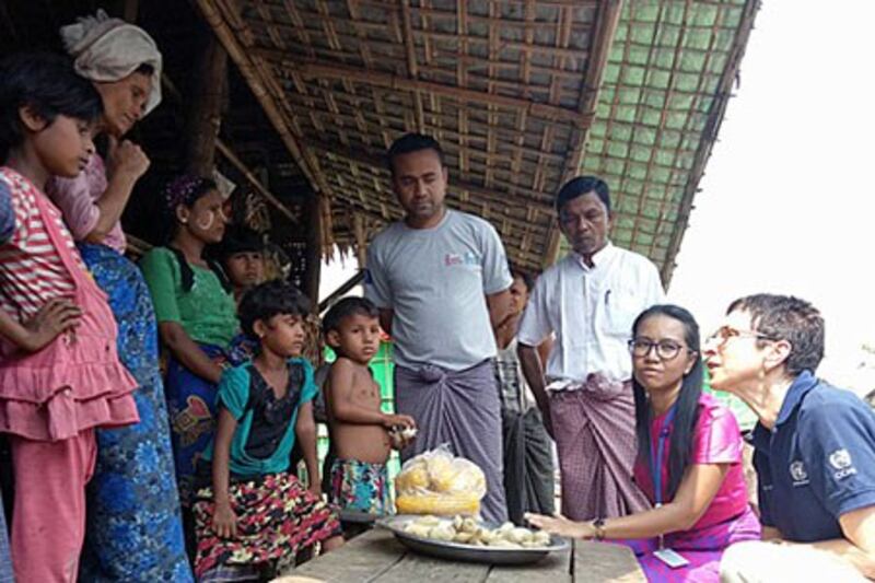 Ursula Mueller (R), the UN's deputy humanitarian chief, talks to Rohingya Muslims at an internally displaced persons camp in Sittwe township, western Myanmar's Rakhine state, April 4, 2018.