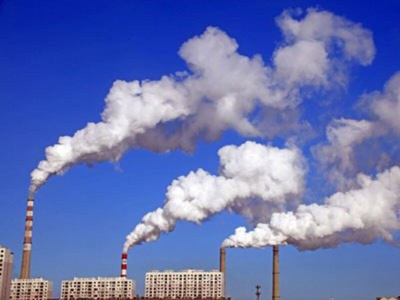 Smoke is discharged from chimneys at a coal-fired power plant in Jilin city, capital of northeastern China's Jilin province, Jan. 8, 2014. 
