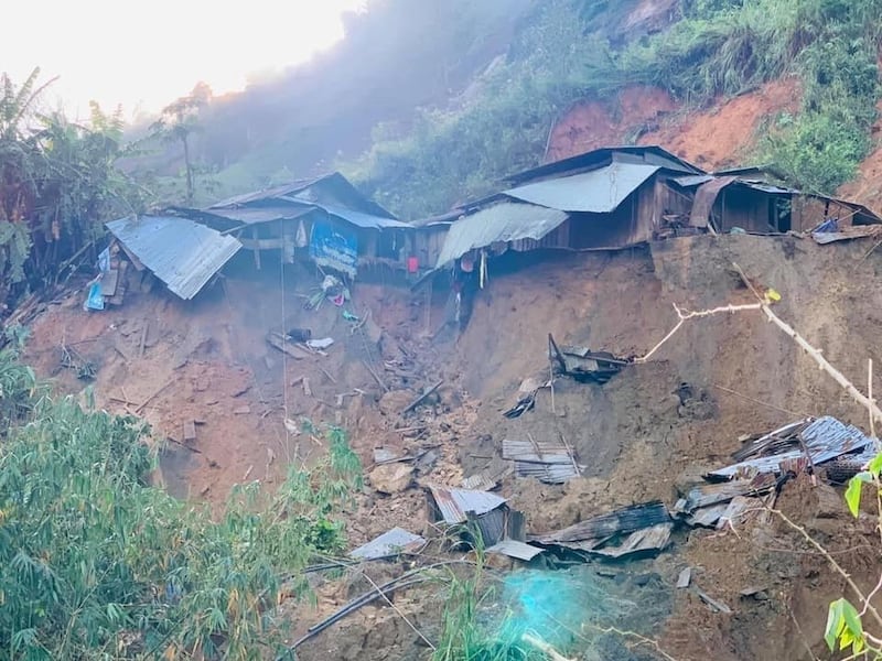 A landslide damages houses in a village in Phuoc Loc district, Quang Nam province, Vietnam Thursday, Oct. 29, 2020. Three separated landslides triggered by Typhoon Molave killed more than a dozen villagers in the province as rescuers scramble to recover more victims. 