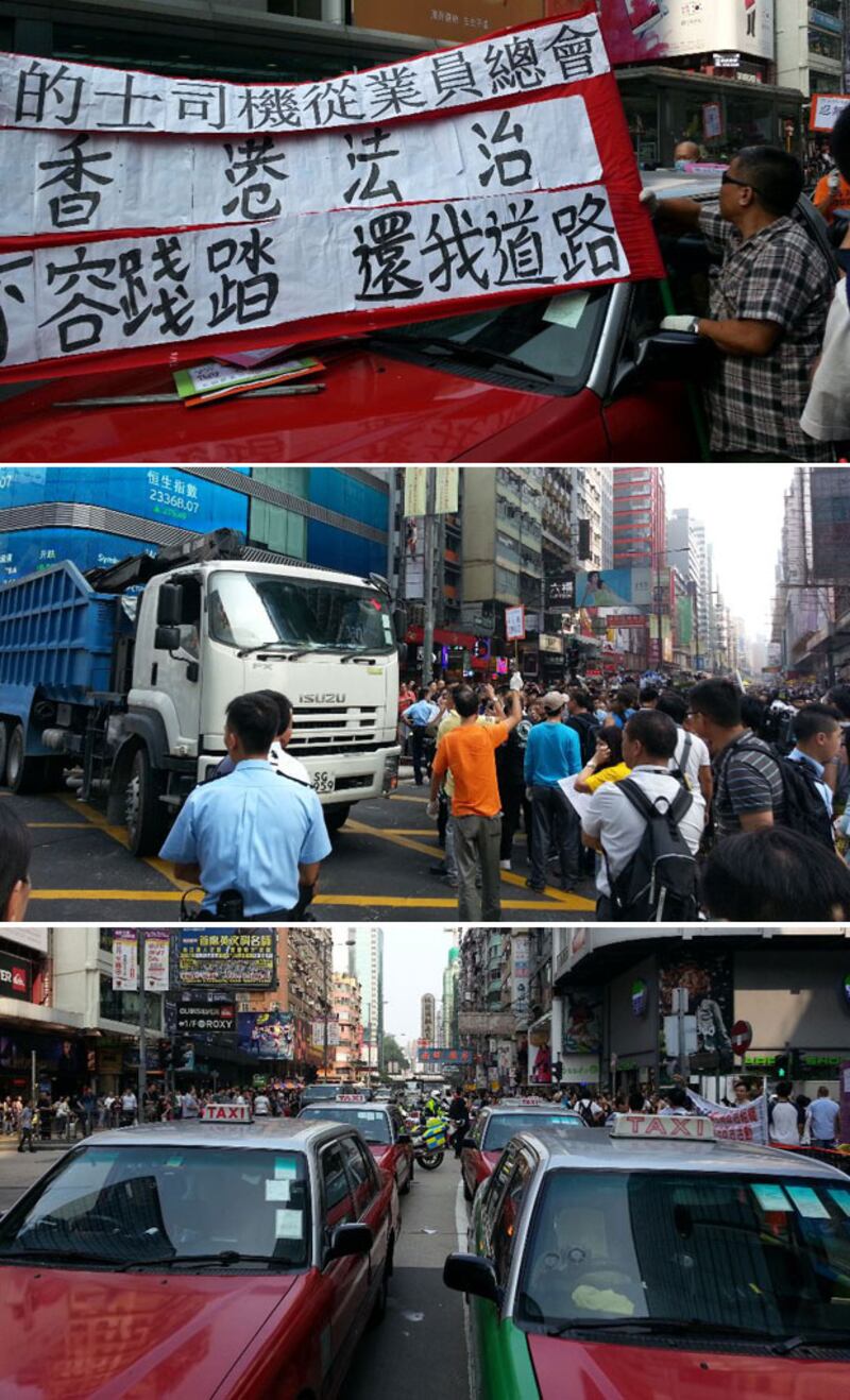 2014年10月22日，一部泥頭車到旺角彌敦道協助清走障礙物。另有十多部的士駛到彌敦道同亞皆老街交界位，抗議佔領人士堵塞。（粵語部記者林靜攝） 