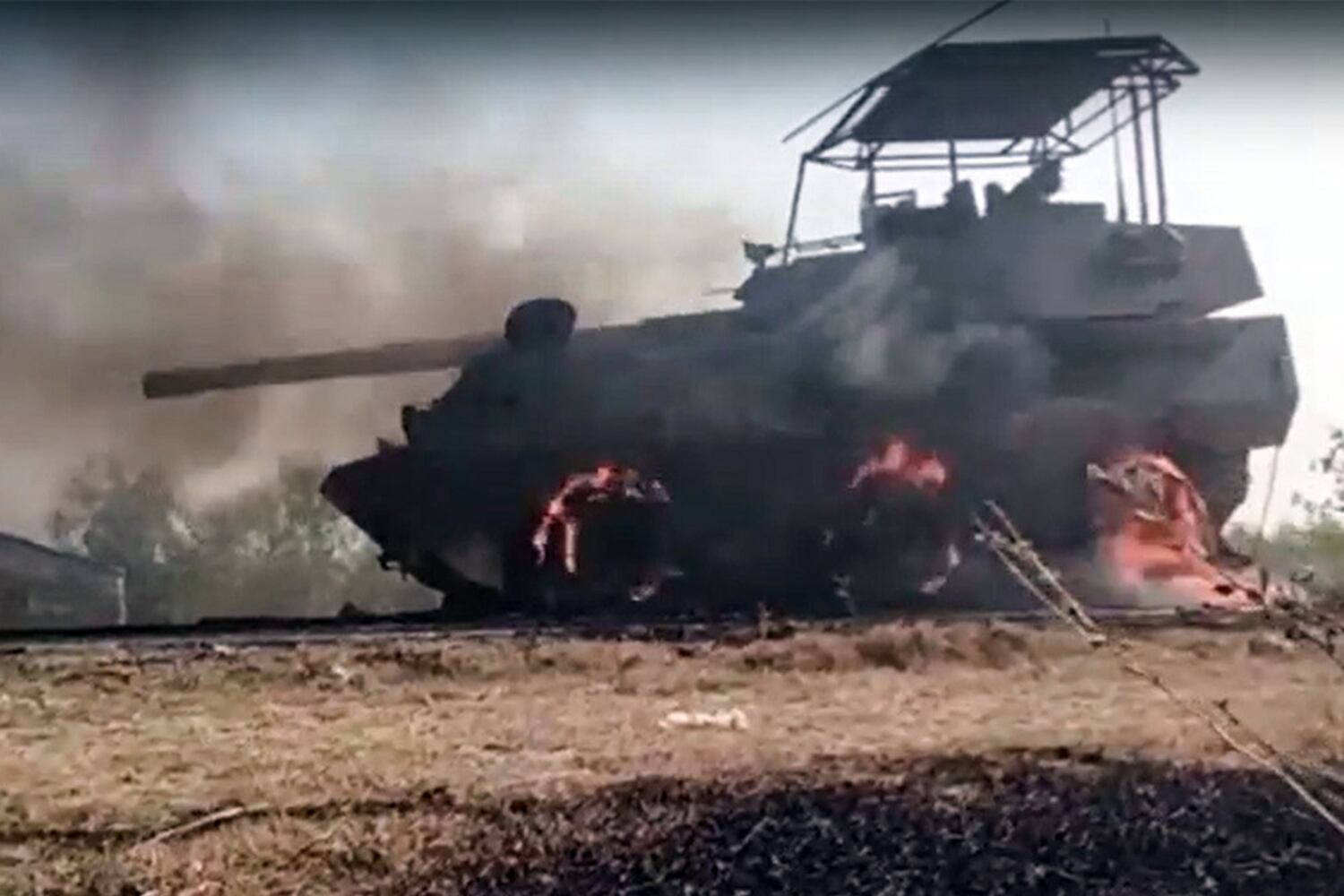 A Myanmar junta armored vehicle burns after Arakan Army forces attacked a column that left Sittwe in western Myanmar's Rakhine state, Feb. 28, 2024.