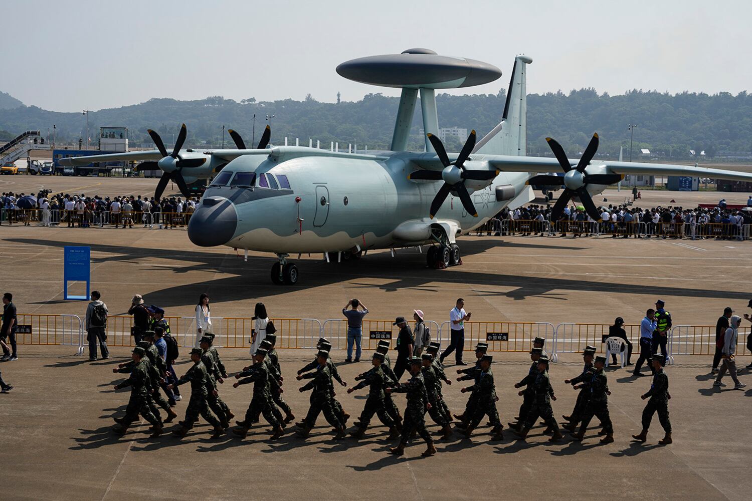 Chinese soldiers march past the Chinese KJ-500A AWACS airplane displayed at Airshow China 2024 at Zhuhai in China's Guangdong province on Nov. 12, 2024.