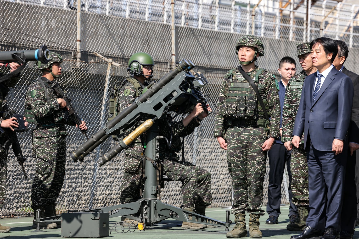 Taiwan's President Lai Ching-te watches soldiers demonstrating the U.S.-made FIM-92 Stinger man-portable air-defense system at Songshan military airbase in Taipei, March 21, 2025.