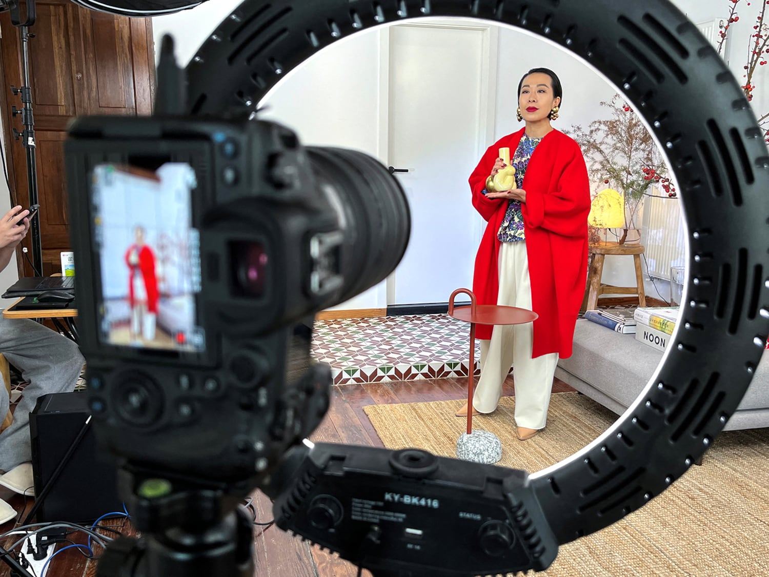 Influencer Tera Feng prepares to host a livestream sales session on the social media platform Xiaohongshu, at her apartment in Shanghai, China, Dec. 16, 2024.