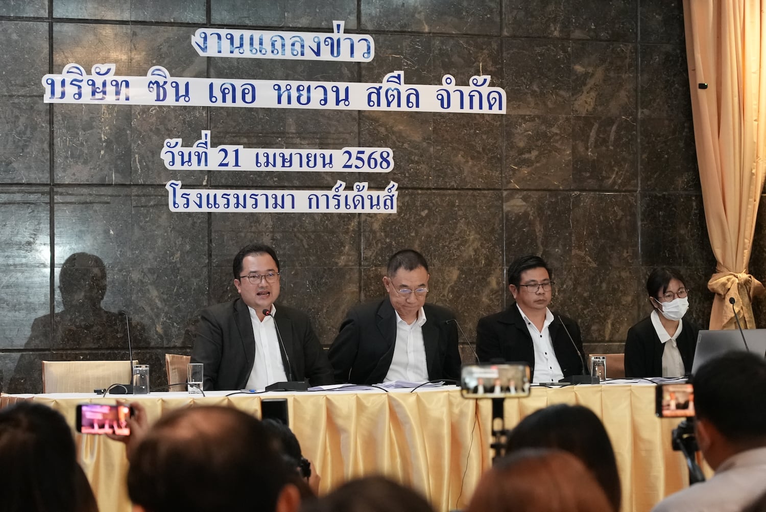 Xin Ke Yuan’s lawyer Piyapong Kongmaruan, left, and his associate lawyer speak to the media at a Bangkok hotel on April 21, 2025