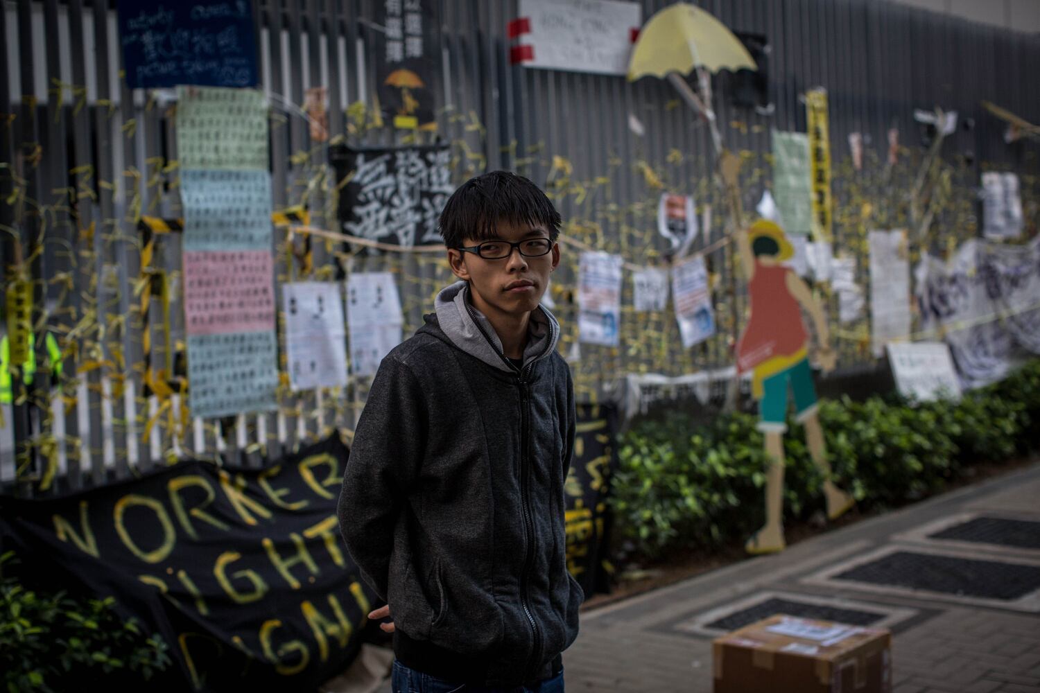 Student leader and pro-democracy activist Joshua Wong speaks to media on a road outside the Hong Kong Government complex on November 17, 2014 in Hong Kong. (Chris McGrath/Getty Images)