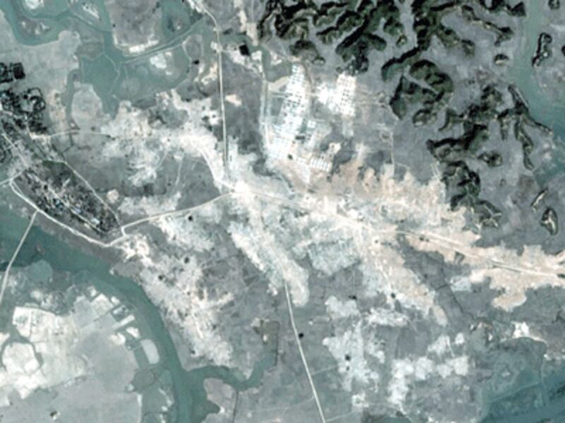 A handout satellite image taken by DigitalGlobe on Feb. 19, 2018, and released by Human Rights Watch on Feb. 23, 2018, allegedly shows the ongoing demolition of Rohingya villages in Myanmar's northern Rakhine State.