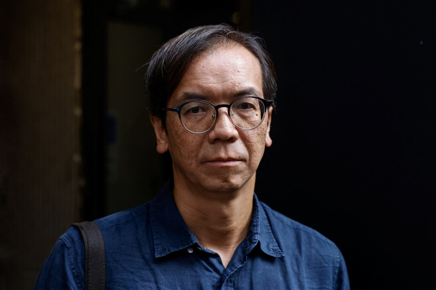 Chung Pui-kuen leaves the district court on bail after the verdict in a landmark sedition trial in Hong Kong, Aug. 29, 2024.