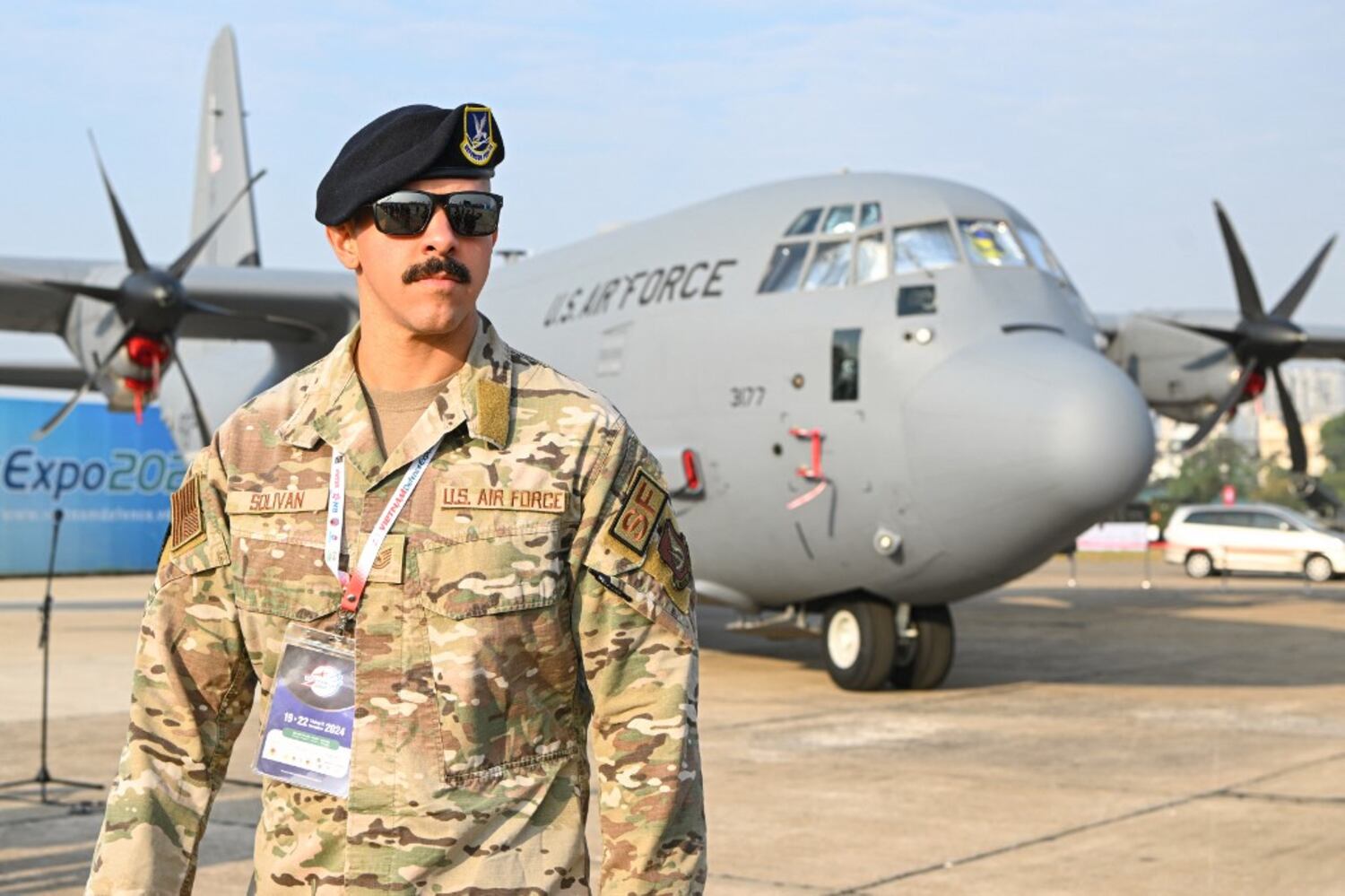 A member of the US Air Force walks near a US Air Force C-130J Super Hercules transport aircraft during the Vietnam 2024 International Defense Expo in Hanoi on Dec. 19, 2024.