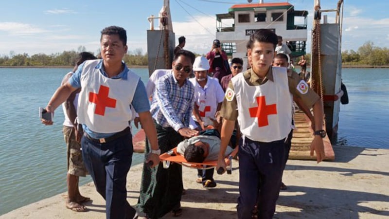 Injured people from Kyauktan village in Rathedaung township are carried on stretchers as they arrive in Sittwe, capital of western Myanmar's Rakhine state, May 2, 2019.