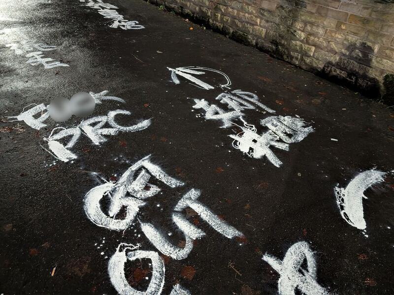 Anti-Communist Party slogans written on the sidewalk and wall outside the Chinese Consulate in Manchester, Dec. 28, 2024.