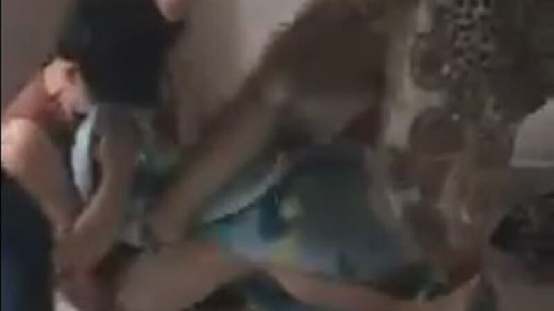 A screen grab from a video shows unidentified assailants attacking Le My Hanh and her friends at a home in Ho Chi Minh City on May 2, 2017.