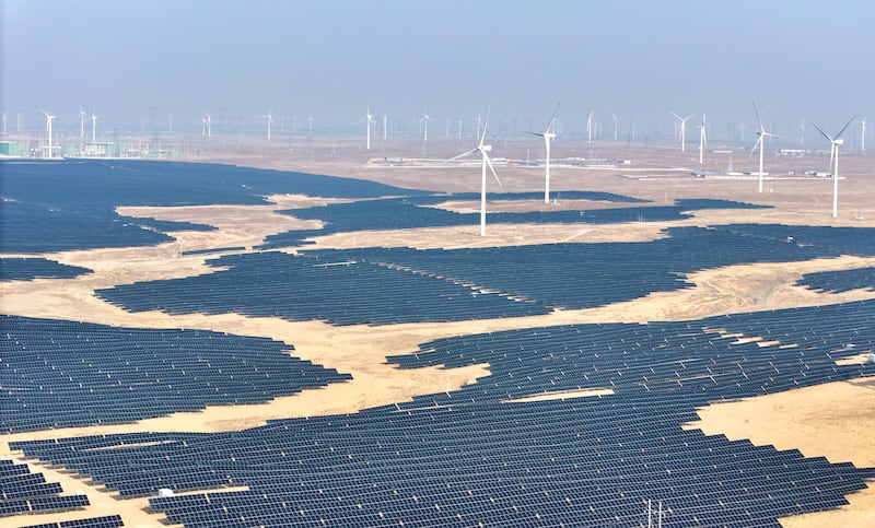Solar panels and wind turbines at a renewable energy farm in Lingwu, in China's northern Ningxia region, Dec. 22, 2025