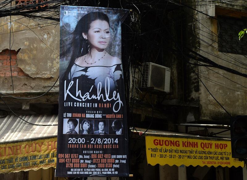 This picture taken on July 28, 2014 shows a poster featuring an upcoming live performance by well-known exiled Vietnamese singer Khanh Ly in downtown Hanoi. Credit: AFP