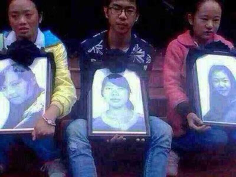 Friends hold photos of Tibetan students mowed down by car, Sept. 26, 2014. Credit: RFA listener