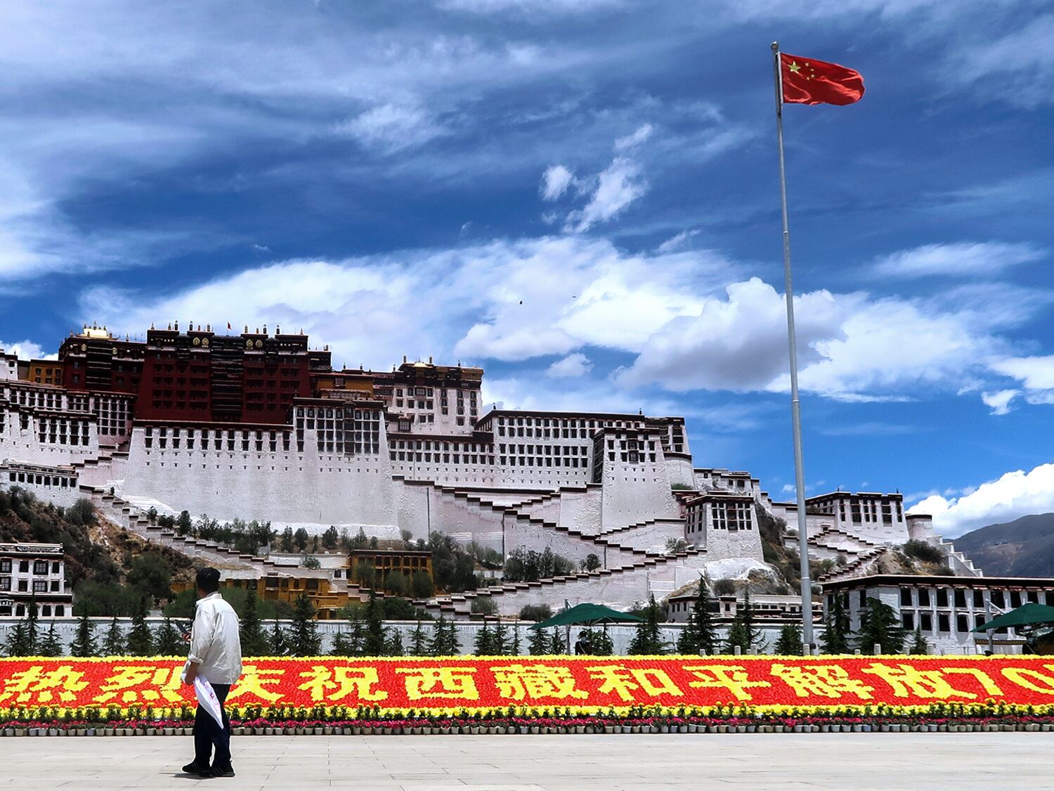 A sign marking 70 years of Chinese rule over the Tibet Autonomous Region, on Potala Palace Square in Tibet's capital,  June 1, 2021.