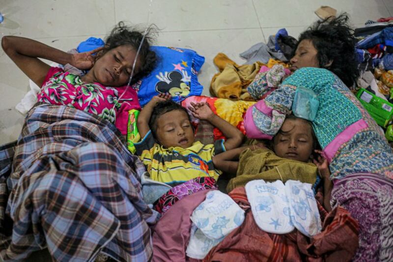 Rohingya refugees take a nap upon their arrival at a temporary shelter at the Ujong Pi village in Muara Tiga sub-district of Pidie, Aceh Province on December 26, 2022. Credit: AFP